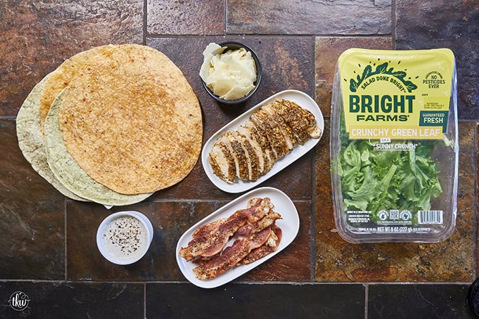 Juicy oven-baked chicken, crispy bacon, fresh lettuce, and creamy Parmesan-peppercorn dressing come together in a soft flour tortilla for the ultimate chicken wrap. These 6-ingredient wraps are perfect for meal prep, busy schedules, and grab-and-go bites!