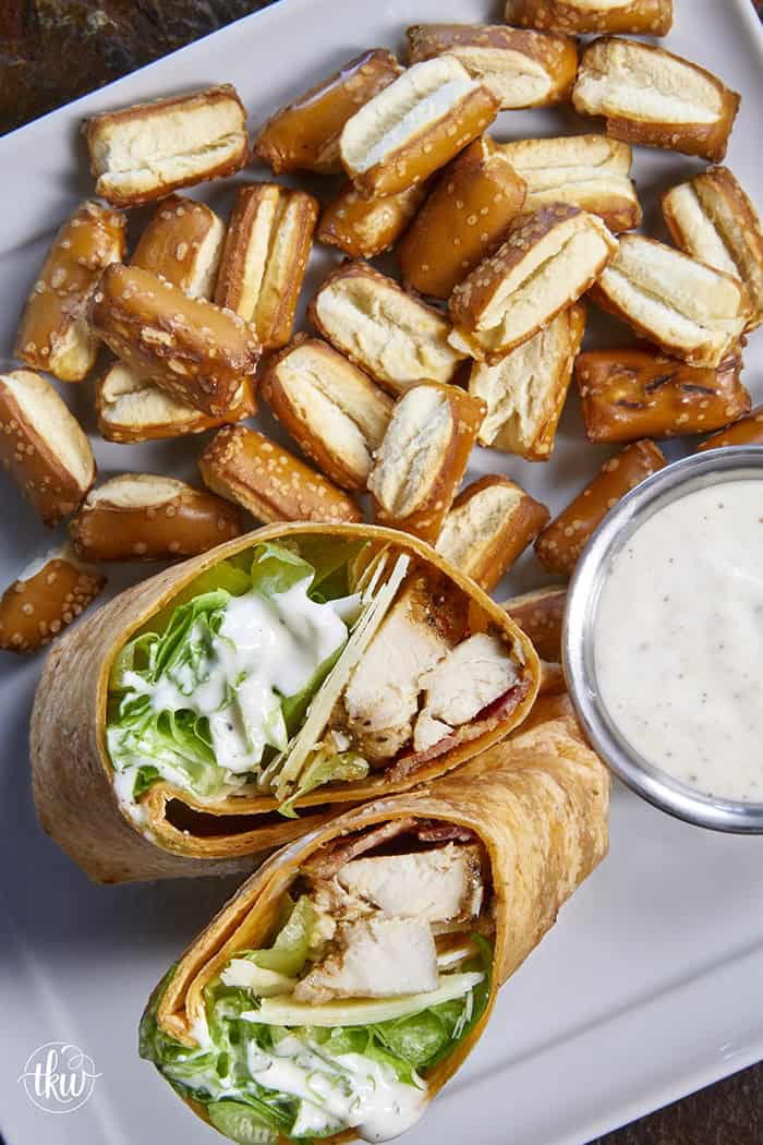 Juicy oven-baked chicken, crispy bacon, fresh lettuce, and creamy Parmesan-peppercorn dressing come together in a soft flour tortilla for the ultimate chicken wrap. These 6-ingredient wraps are perfect for meal prep, busy schedules, and grab-and-go bites!