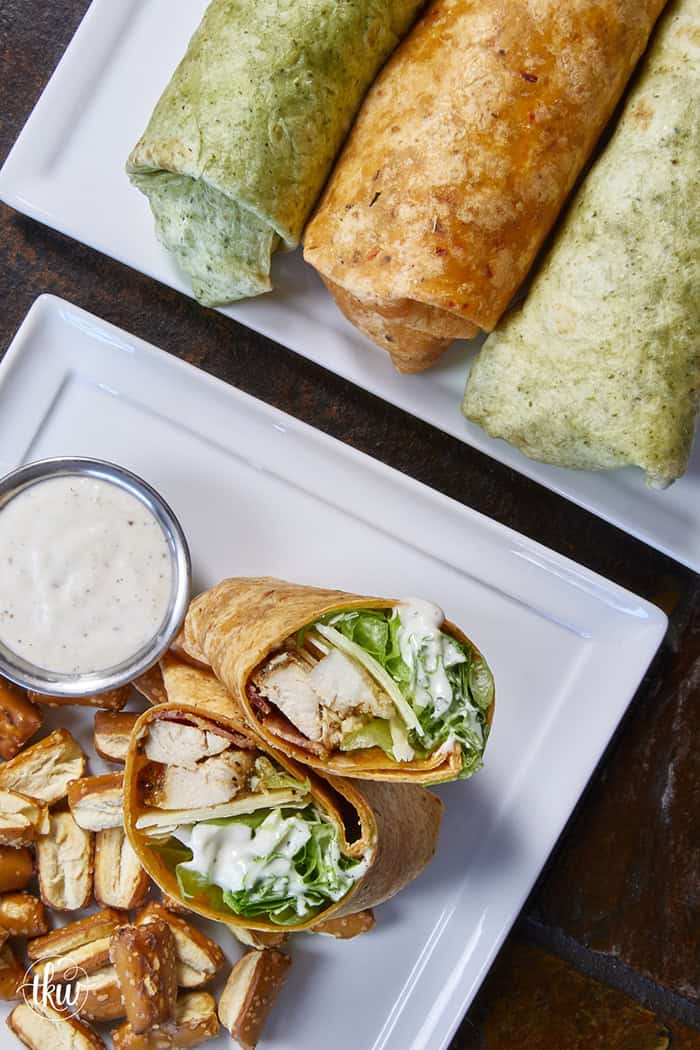 Juicy oven-baked chicken, crispy bacon, fresh lettuce, and creamy Parmesan-peppercorn dressing come together in a soft flour tortilla for the ultimate chicken wrap. These 6-ingredient wraps are perfect for meal prep, busy schedules, and grab-and-go bites!