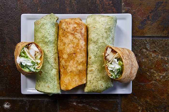 Juicy oven-baked chicken, crispy bacon, fresh lettuce, and creamy Parmesan-peppercorn dressing come together in a soft flour tortilla for the ultimate chicken wrap. These 6-ingredient wraps are perfect for meal prep, busy schedules, and grab-and-go bites!