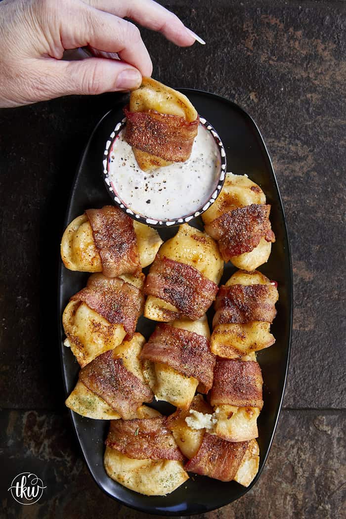 Crispy, creamy, and incredibly snackable, these baked bacon-wrapped pierogies are always the first to go. Made with just 3 simple ingredients, the pierogies stay soft and creamy on the inside while the seasoned bacon wrapping turns perfectly crispy. This is the bite that everyone keeps reaching for!