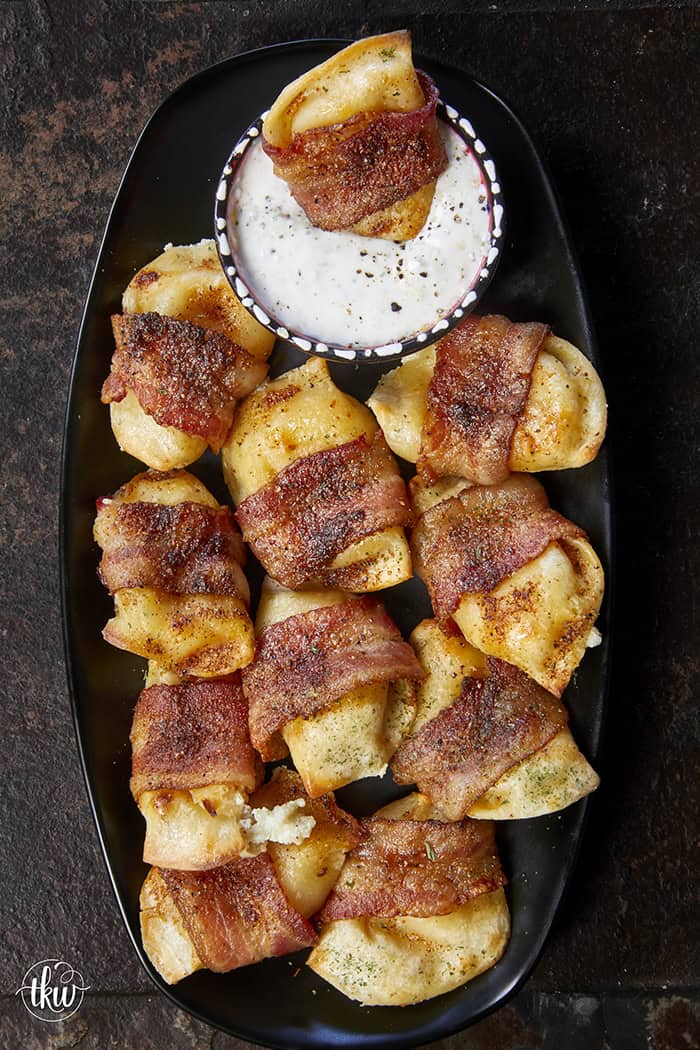Crispy, creamy, and incredibly snackable, these baked bacon-wrapped pierogies are always the first to go. Made with just 3 simple ingredients, the pierogies stay soft and creamy on the inside while the seasoned bacon wrapping turns perfectly crispy. This is the bite that everyone keeps reaching for!