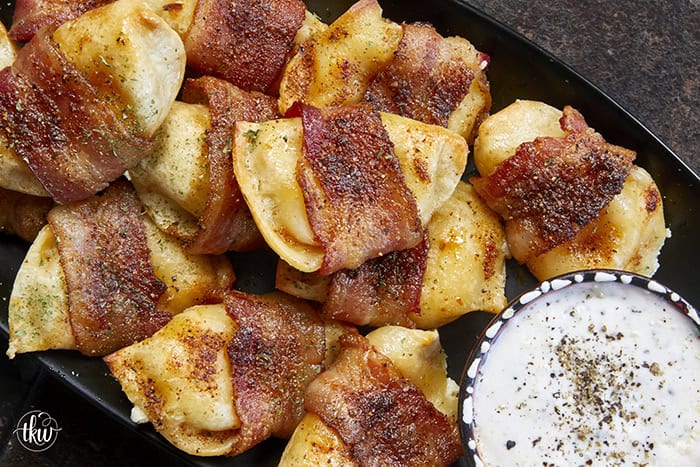 Crispy, creamy, and incredibly snackable, these baked bacon-wrapped pierogies are always the first to go. Made with just 3 simple ingredients, the pierogies stay soft and creamy on the inside while the seasoned bacon wrapping turns perfectly crispy. This is the bite that everyone keeps reaching for!