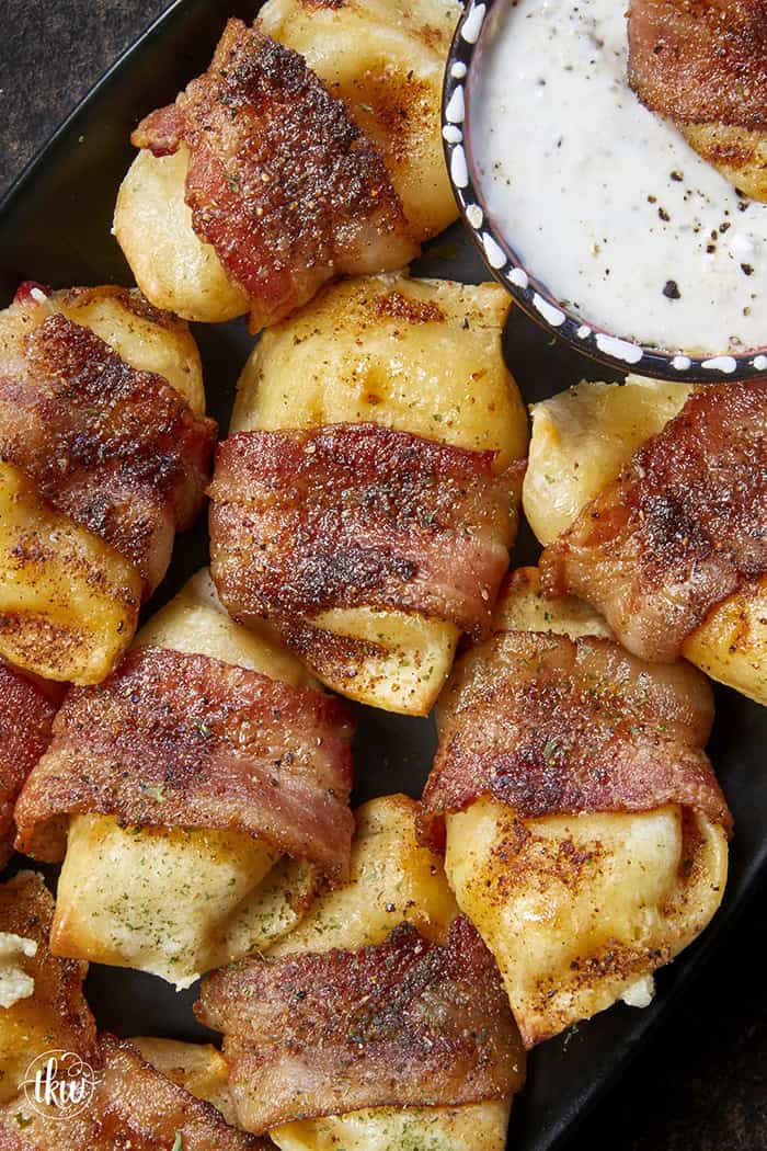 Crispy, creamy, and incredibly snackable, these baked bacon-wrapped pierogies are always the first to go. Made with just 3 simple ingredients, the pierogies stay soft and creamy on the inside while the seasoned bacon wrapping turns perfectly crispy. This is the bite that everyone keeps reaching for!