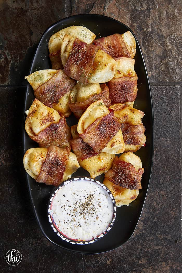 Crispy, creamy, and incredibly snackable, these baked bacon-wrapped pierogies are always the first to go. Made with just 3 simple ingredients, the pierogies stay soft and creamy on the inside while the seasoned bacon wrapping turns perfectly crispy. This is the bite that everyone keeps reaching for!