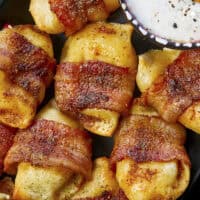 Crispy, creamy, and incredibly snackable, these baked bacon-wrapped pierogies are always the first to go. Made with just 3 simple ingredients, the pierogies stay soft and creamy on the inside while the seasoned bacon wrapping turns perfectly crispy. This is the bite that everyone keeps reaching for!