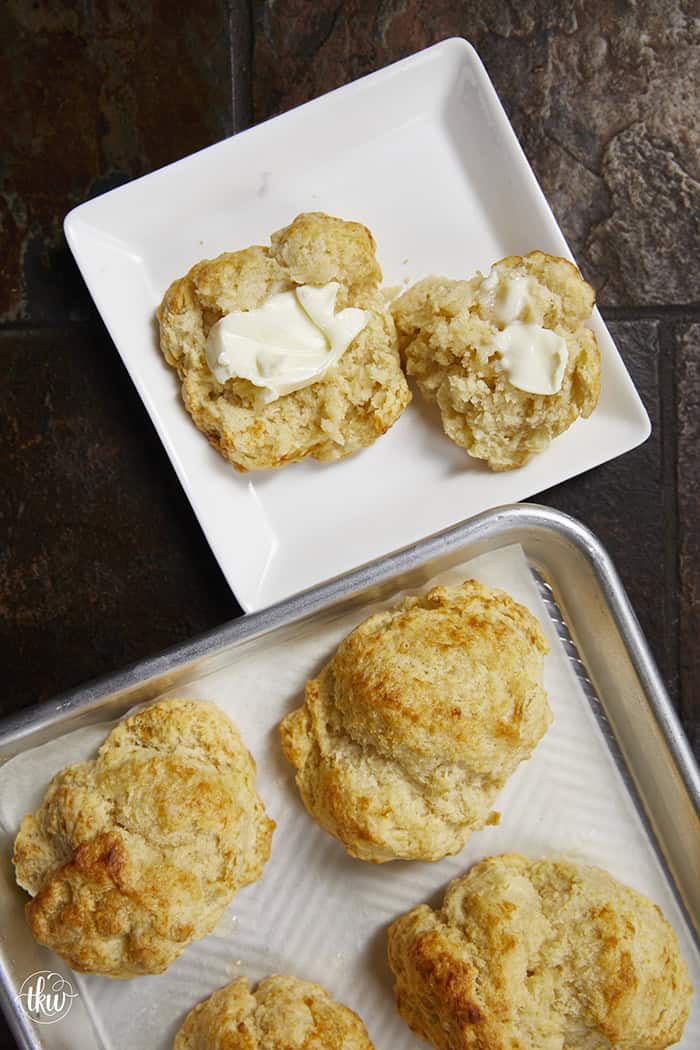 There is nothing quite like the smell of warm, buttery biscuits in the kitchen to bring back those childhood memories of Mom's kitchen. My family's tried-and-true buttermilk drop biscuits are pure love, with a golden crunch, a fluffy center, and a buttery bite!