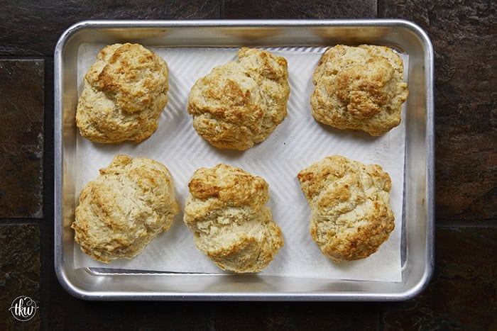 There is nothing quite like the smell of warm, buttery biscuits in the kitchen to bring back those childhood memories of Mom's kitchen. My family's tried-and-true buttermilk drop biscuits are pure love, with a golden crunch, a fluffy center, and a buttery bite!