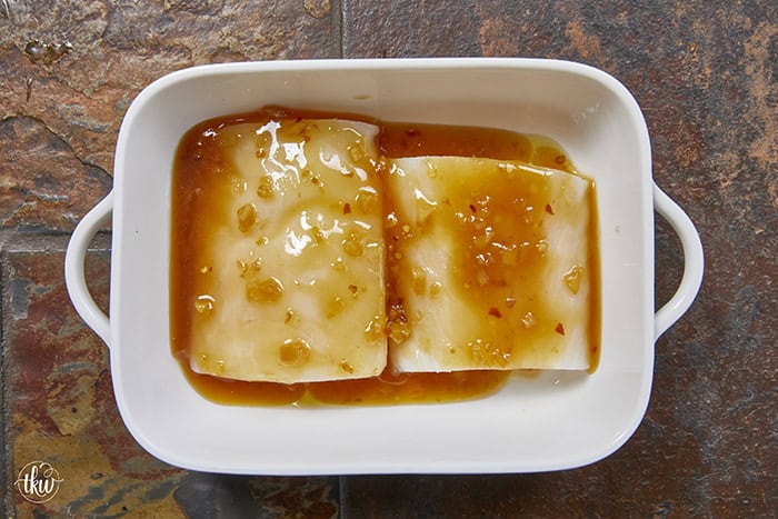 This honey garlic baked cod is flaky, caramelized on the edges, and honestly tastes way more expensive than it actually is. Transform your simple baked fish into an elegant meal any night of the week. #EasyRecipes #HealthyDinner #CodRecipe #honeygarlicsauce #stirfrysauce #bakedwhitefish