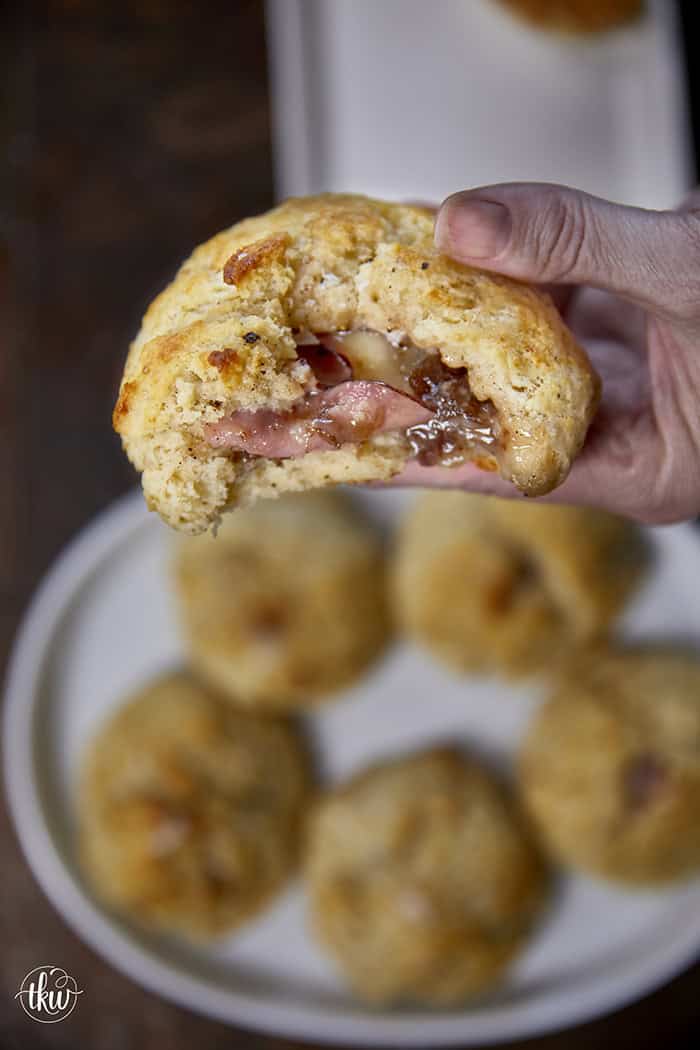 Taking my family's classic buttermilk drop biscuit recipe and give it a sophisticated, savory upgrade with savory ham, melted brie, fig jam, and black pepper. Perfect any time of the day, meal prep, and freeze meals. #ButtermilkBiscuits #BrunchRecipes #SavoryBaking #ComfortFood #stuffedbiscuits #hamandcheesebiscuits
