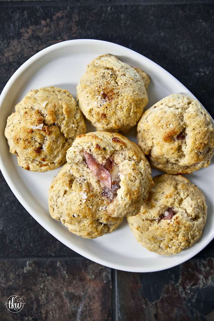 Taking my family's classic buttermilk drop biscuit recipe and give it a sophisticated, savory upgrade with savory ham, melted brie, fig jam, and black pepper. Perfect any time of the day, meal prep, and freeze meals. #ButtermilkBiscuits #BrunchRecipes #SavoryBaking #ComfortFood #stuffedbiscuits #hamandcheesebiscuits