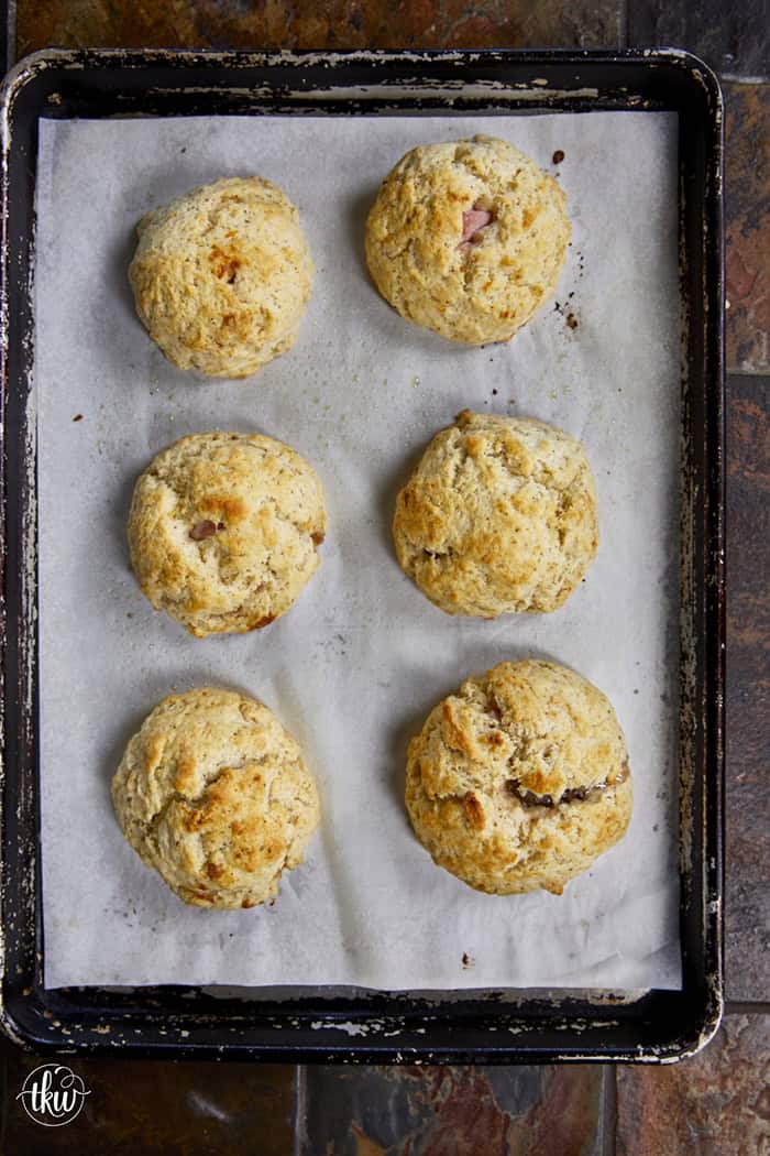Taking my family's classic buttermilk drop biscuit recipe and give it a sophisticated, savory upgrade with savory ham, melted brie, fig jam, and black pepper. Perfect any time of the day, meal prep, and freeze meals. #ButtermilkBiscuits #BrunchRecipes #SavoryBaking #ComfortFood #stuffedbiscuits #hamandcheesebiscuits