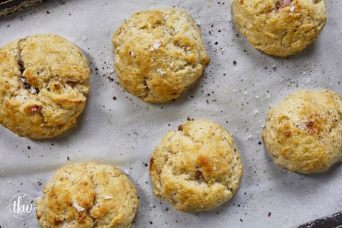 Taking my family's classic buttermilk drop biscuit recipe and give it a sophisticated, savory upgrade with savory ham, melted brie, fig jam, and black pepper. Perfect any time of the day, meal prep, and freeze meals. #ButtermilkBiscuits #BrunchRecipes #SavoryBaking #ComfortFood #stuffedbiscuits #hamandcheesebiscuits