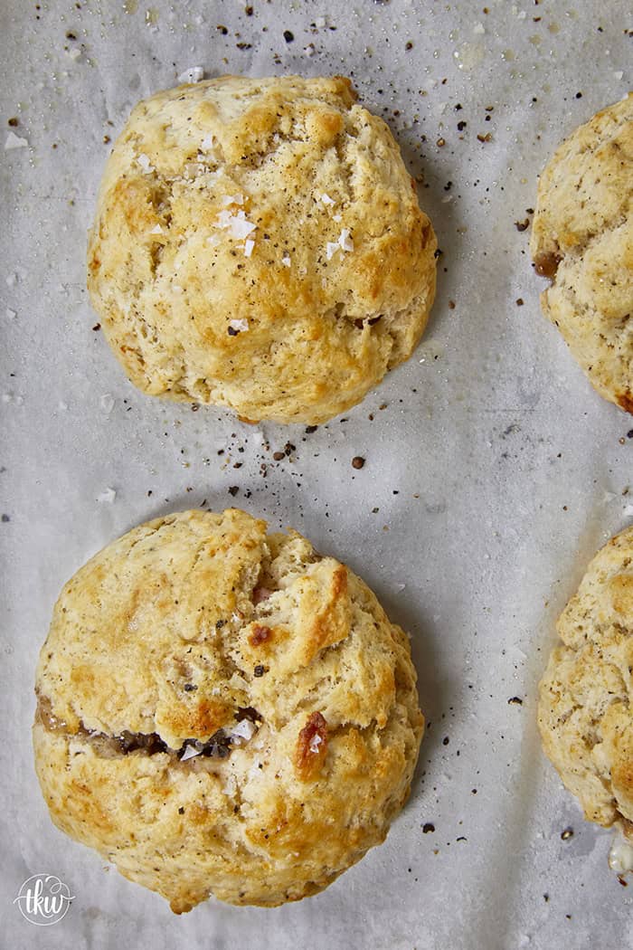 Taking my family's classic buttermilk drop biscuit recipe and give it a sophisticated, savory upgrade with savory ham, melted brie, fig jam, and black pepper. Perfect any time of the day, meal prep, and freeze meals. #ButtermilkBiscuits #BrunchRecipes #SavoryBaking #ComfortFood #stuffedbiscuits #hamandcheesebiscuits