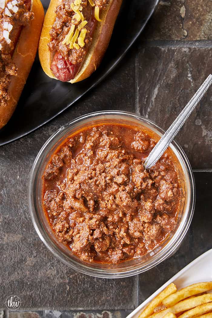 This Homemade Chili Dog Sauce is thick, savory, and the only recipe you’ll ever need. It’s a bean-free, pantry-staple meat sauce that stays on the dog and tastes like it simmered all day. Perfect for your next backyard BBQ, game day nachos, or loaded fries! One bite and you'll never go back to store-bought. #ChiliDog #SummerGrilling #ChiliDogSauce #EasyRecipes
