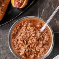 This Homemade Chili Dog Sauce is thick, savory, and the only recipe you’ll ever need. It’s a bean-free, pantry-staple meat sauce that stays on the dog and tastes like it simmered all day. Perfect for your next backyard BBQ, game day nachos, or loaded fries! One bite and you'll never go back to store-bought. #ChiliDog #SummerGrilling #ChiliDogSauce #EasyRecipes