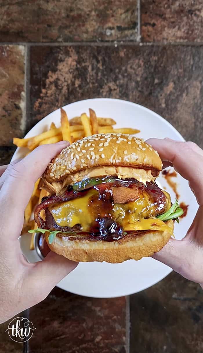 This Blueberry Jalapeño PB&J Bacon Cheeseburger is the best burger of the summer! Smoked ground brisket, melted cheddar, crispy bacon, and a sweet heat kick of blueberry jalapeño balsamic jam. #PBJBurger #BurgerRecipes #GrillingSeason