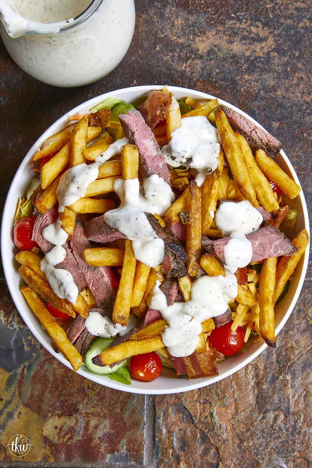 This authentic Pittsburgh Steak Salad features juicy, seared steak strips and a mountain of crispy, golden fries over fresh romaine , veggies, and cool ranch. It&rsquo;s a Steel City classic that proves fries belong on everything! Perfect for a hearty lunch or a quick weeknight dinner. #PittsburghSteakSalad #SteelCityEats #FriesOnEverything #SaladGoals #EasyDinner