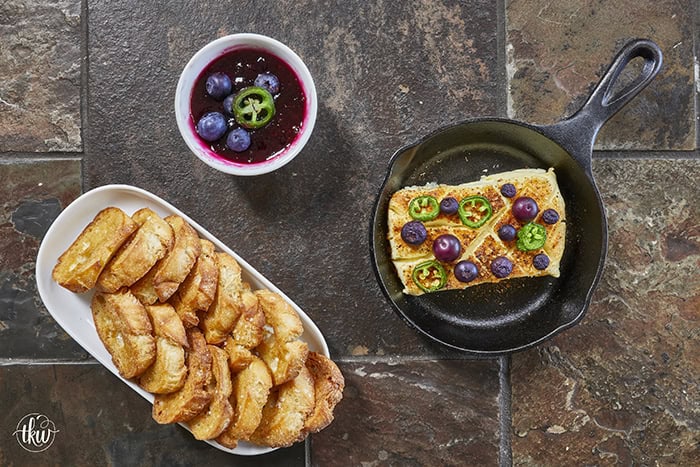 Looking for a killer appetizer? Try this Smoked Cream Cheese with Blueberry and Jalapeno Jam! A block of cream cheese gets a rich, wood-fired smoky flavor, then gets topped with a sweet-heat berry jam. It takes under 10 minutes of hands-on prep, and I'll show you how to make it in a smoker, grill, or kitchen oven. It is the perfect dip for party crackers, a spread for bagels, or a burger topper! #SmokedCreamCheese #SmokerRecipes #EasyAppetizers