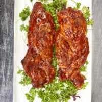 Upgrade dinner with this Air Fryer Braided BBQ Pork Tenderloin! Braiding the meat creates a perfectly caramelized crust while keeping the inside incredibly juicy. It looks like a gourmet competition dish but takes under 30 minutes. #AirFryerRecipes #PorkTenderloin #BBQSeason
