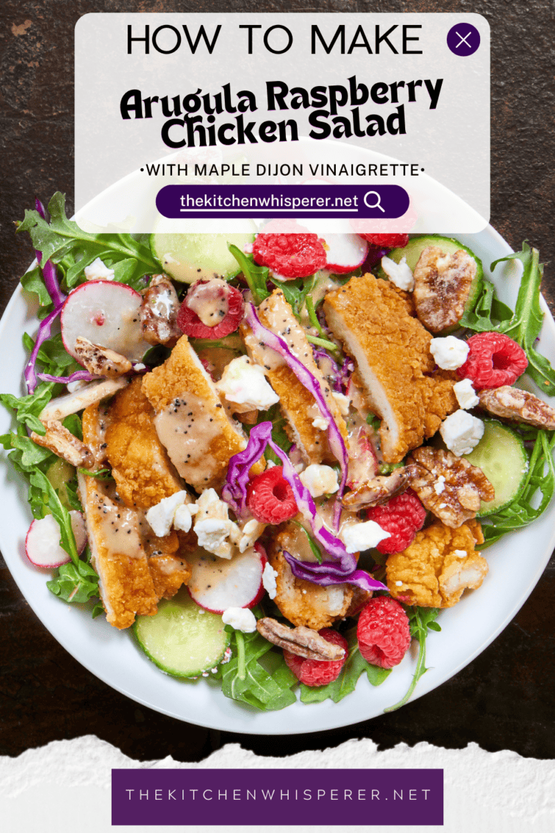This Arugula Raspberry Chicken Salad is the perfect mix of sweet and savory. Tender chicken, juicy raspberries, sharp radishes, feta, & candied pecans topped with a homemade maple Dijon vinaigrette. #ChickenSaladRecipes #ArugulaSalad #SummerSalad