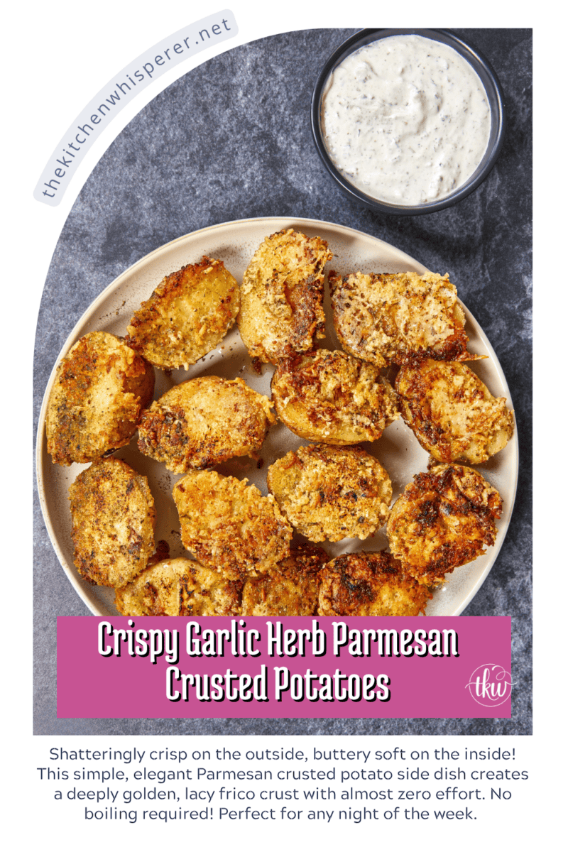 Shatteringly crisp on the outside, buttery soft on the inside! This simple, elegant parmesan crusted potato side dish creates a deeply golden, lacy frico crust with almost zero effort. No boiling required! Perfect for any night of the week. #parmesancrustedpotatoes #easysidedishes #roastedpotatoes