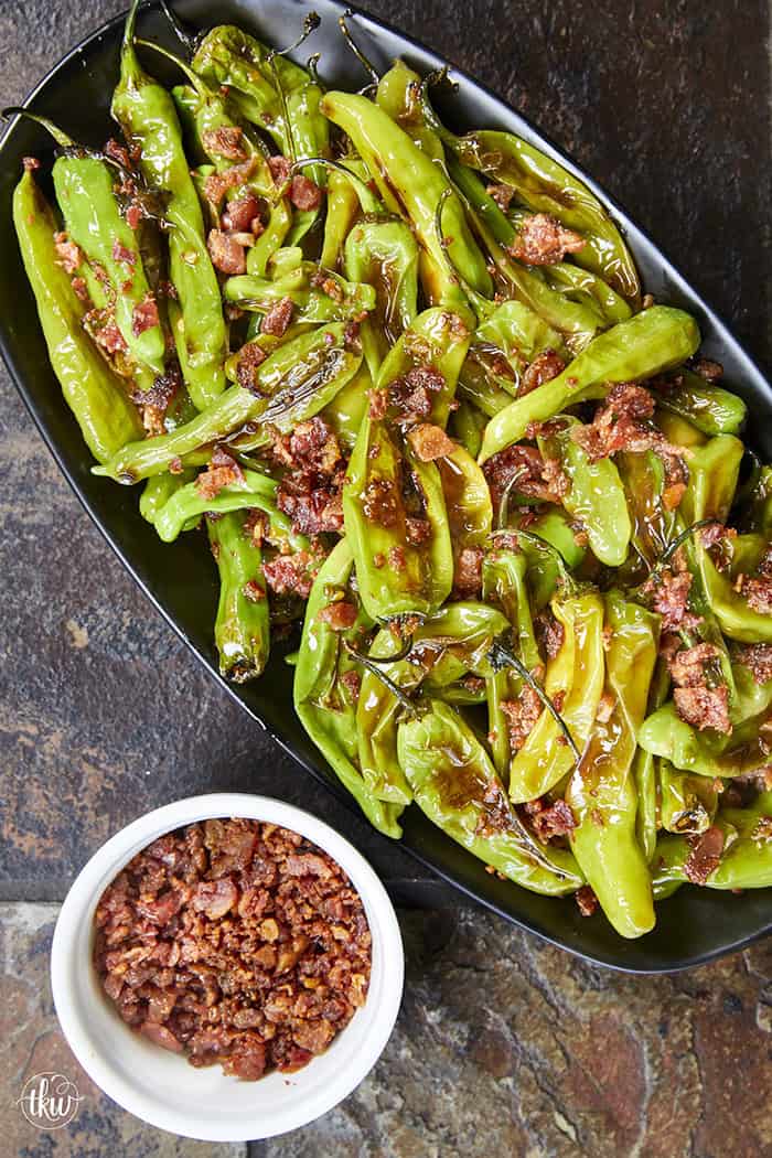 Blistered to perfection and tossed in a sticky, homemade garlic-honey glaze, these shishito peppers hit every single craving. Top them with crispy bacon crumbles for a 15-minute, sweet-and-smoky umami bomb. #ShishitoPeppers #honeygarlicsauce #fingerfoods