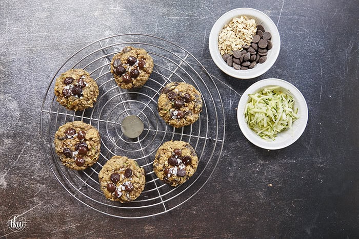 Turn fresh garden zucchini into the ultimate decadent dessert! These thick, chewy oatmeal zucchini chocolate chip cookies pack the perfect balance of hearty oats and gooey dark chocolate pockets, all with deep notes of brown sugar and molasses. Discover the dual-oat secret to keeping these bakery-style cookies perfectly chewy and never cakey. #zucchinicookies #oatmealchocolatechip #cookiesofpinterest