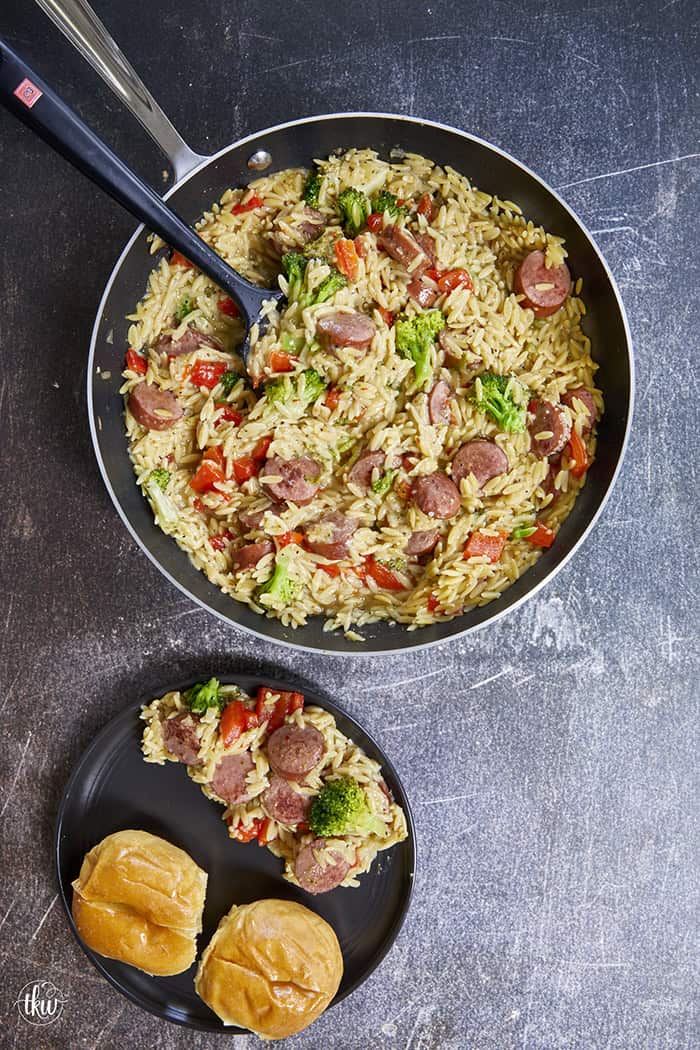 20-minute weeknight dinner made in just ONE skillet! This Sausage Broccoli Orzo combines smoky kielbasa, tender broccoli, and a velvety Parmesan herb sauce—no heavy cream needed. Perfect for busy nights and meal prep! #thekitchenwhisperer #20minutemeals #onepanmeals