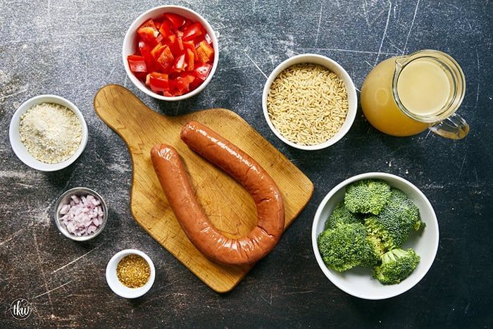 20-minute weeknight dinner made in just ONE skillet! This Sausage Broccoli Orzo combines smoky kielbasa, tender broccoli, and a velvety Parmesan herb sauce—no heavy cream needed. Perfect for busy nights and meal prep! #thekitchenwhisperer #20minutemeals #onepanmeals