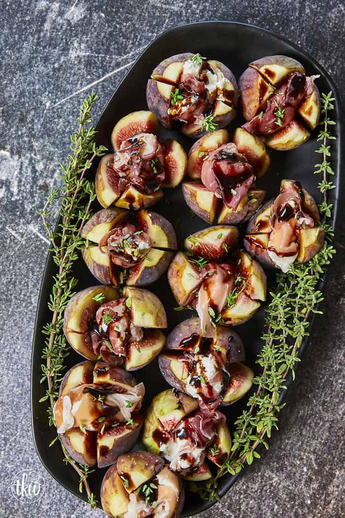 Elegant, easy, and ready in 15 minutes! Fresh figs are stuffed with fluffy whipped goat cheese, wrapped in savory prosciutto, and drizzled with balsamic glaze. Try this simple appetizer today!