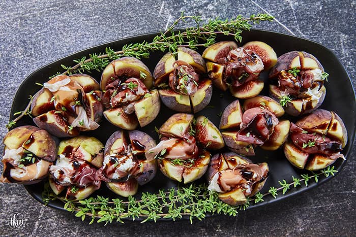 Elegant, easy, and ready in 15 minutes! Fresh figs are stuffed with fluffy whipped goat cheese, wrapped in savory prosciutto, and drizzled with balsamic glaze. Try this simple appetizer today!