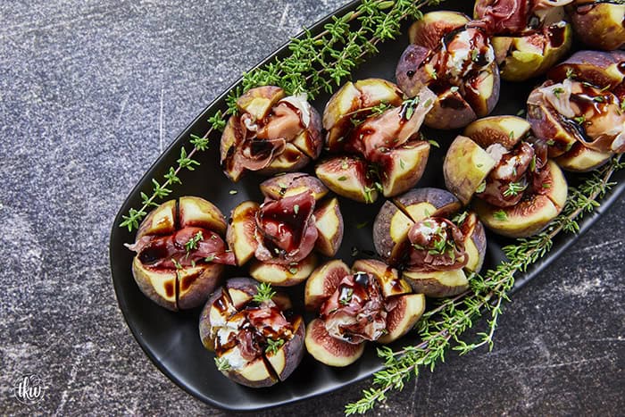 Elegant, easy, and ready in 15 minutes! Fresh figs are stuffed with fluffy whipped goat cheese, wrapped in savory prosciutto, and drizzled with balsamic glaze. Try this simple appetizer today!