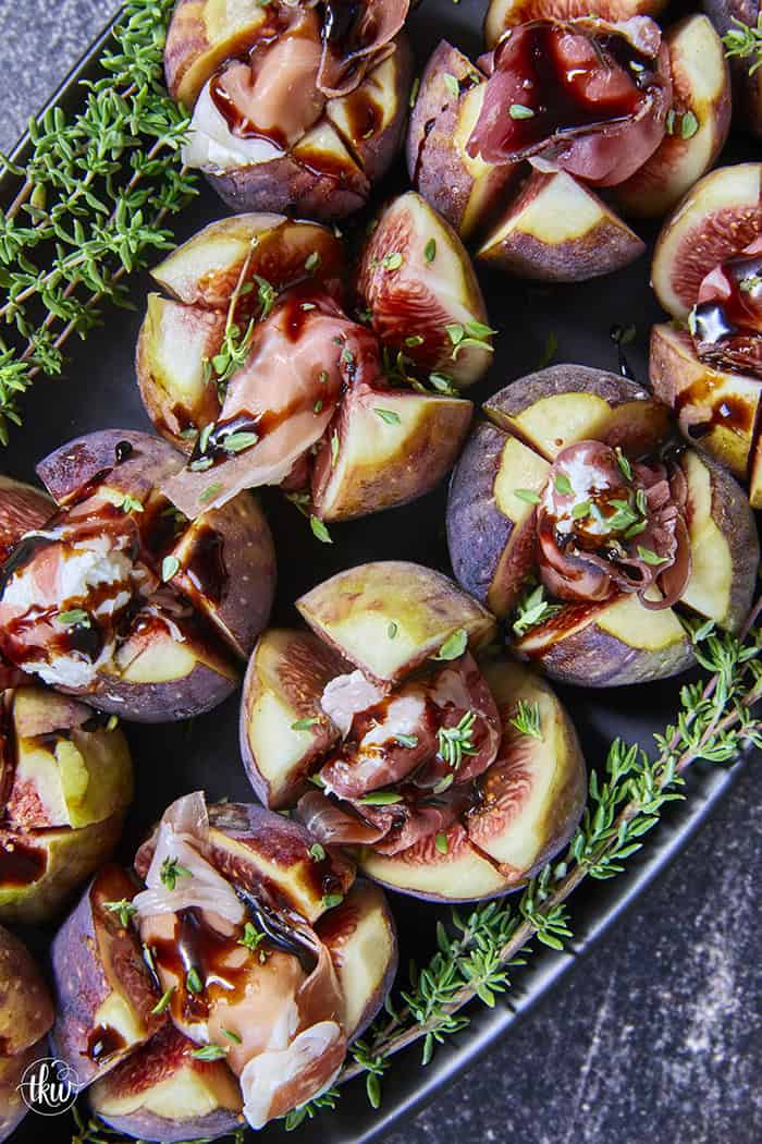Elegant, easy, and ready in 15 minutes! Fresh figs are stuffed with fluffy whipped goat cheese, wrapped in savory prosciutto, and drizzled with balsamic glaze. Try this simple appetizer today!