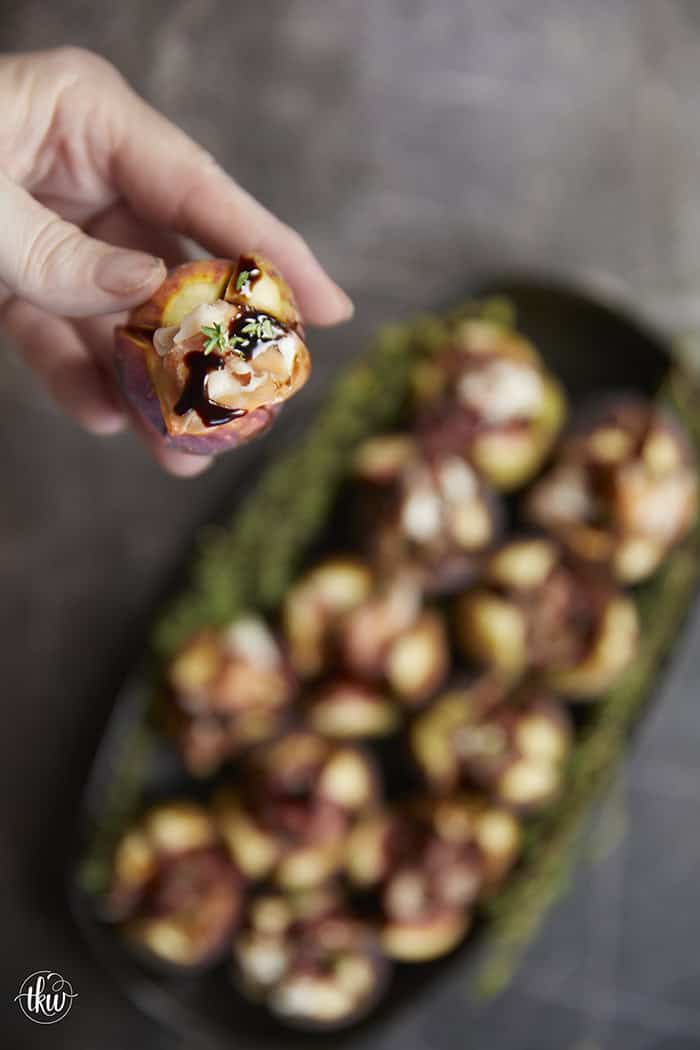 Elegant, easy, and ready in 15 minutes! Fresh figs are stuffed with fluffy whipped goat cheese, wrapped in savory prosciutto, and drizzled with balsamic glaze. Try this simple appetizer today!