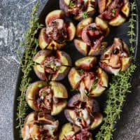 Elegant, easy, and ready in 15 minutes! Fresh figs are stuffed with fluffy whipped goat cheese, wrapped in savory prosciutto, and drizzled with balsamic glaze. Try this simple appetizer today!