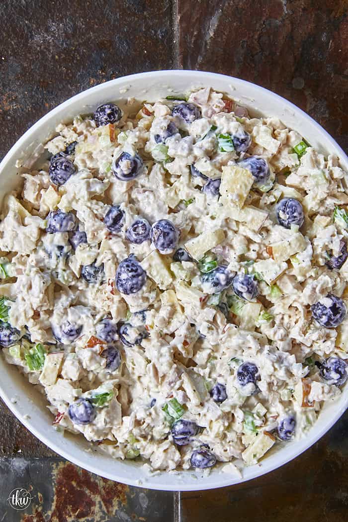 A creamy deli chicken salad packed with tender white meat chicken, sweet fresh blueberries, and crunchy diced apples, accented by shallots, scallions, and celery, all tossed in a seasoned tarragon-mayo dressing brightened with apple cider vinegar.