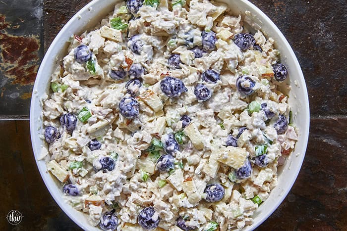 A creamy deli chicken salad packed with tender white meat chicken, sweet fresh blueberries, and crunchy diced apples, accented by shallots, scallions, and celery, all tossed in a seasoned tarragon-mayo dressing brightened with apple cider vinegar.