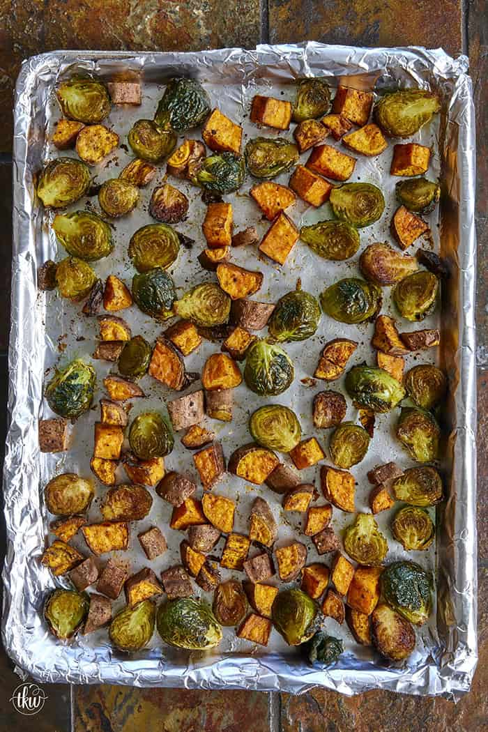 Sheet-pan roasted Brussels sprouts and sweet potatoes tossed in a warm spiced maple glaze and toasted pistachios. An easy side dish that is naturally vegan, gluten-free, and perfect for any dinner table.