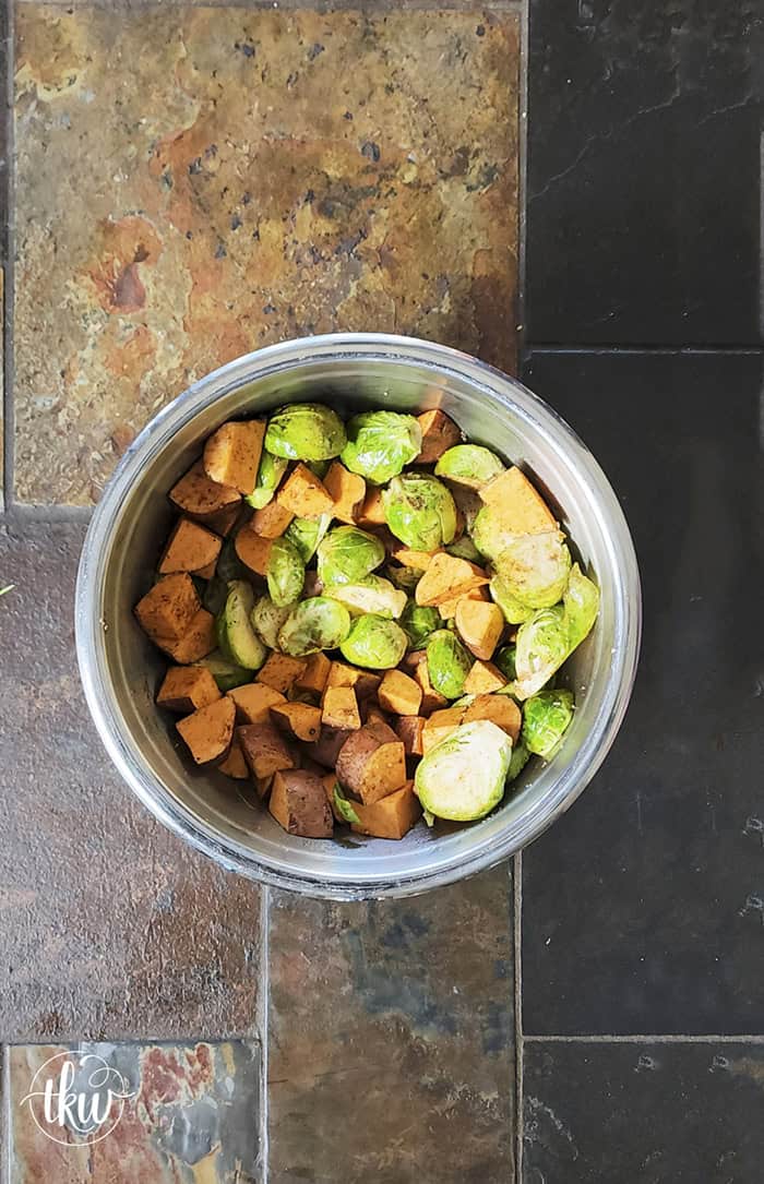 Sheet-pan roasted Brussels sprouts and sweet potatoes tossed in a warm spiced maple glaze and toasted pistachios. An easy side dish that is naturally vegan, gluten-free, and perfect for any dinner table.