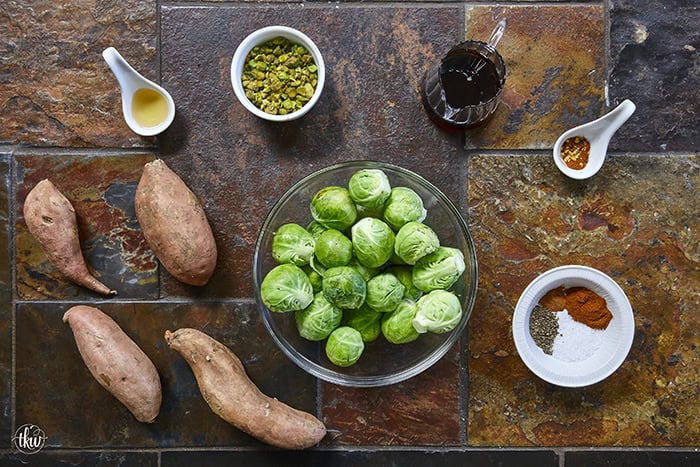 Sheet-pan roasted Brussels sprouts and sweet potatoes tossed in a warm spiced maple glaze and toasted pistachios. An easy side dish that is naturally vegan, gluten-free, and perfect for any dinner table.
